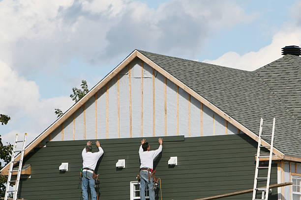 Professional Siding Contractor technician working in Greenville, NC